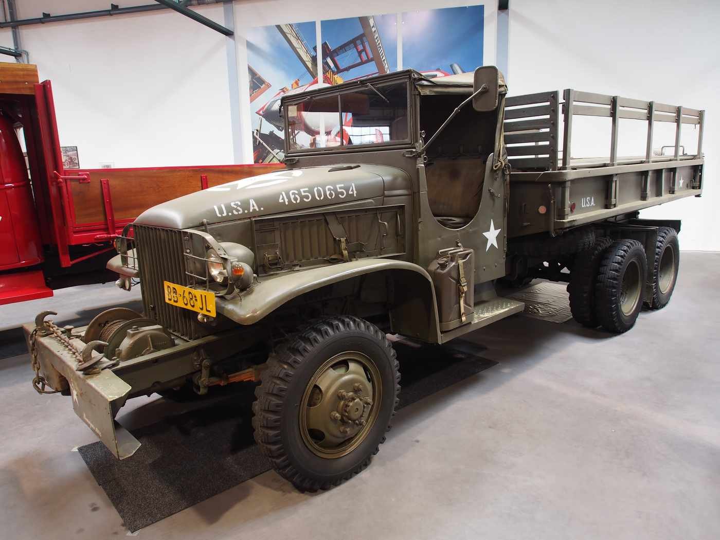 A 1942 GMC CCKW 2½-ton military cargo truck, preserved in a European classic vehicle museum. The CCKW and related models defined heavy truck design on both civilian and military sides through the mid-20th century.